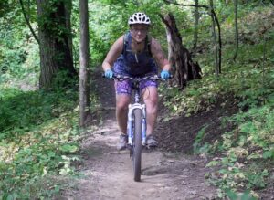 A Mountain Biker Enjoys One Of Michigan’s Flow Trails.- Mountain Biking