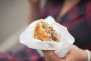 A Hand Holding A Pasty