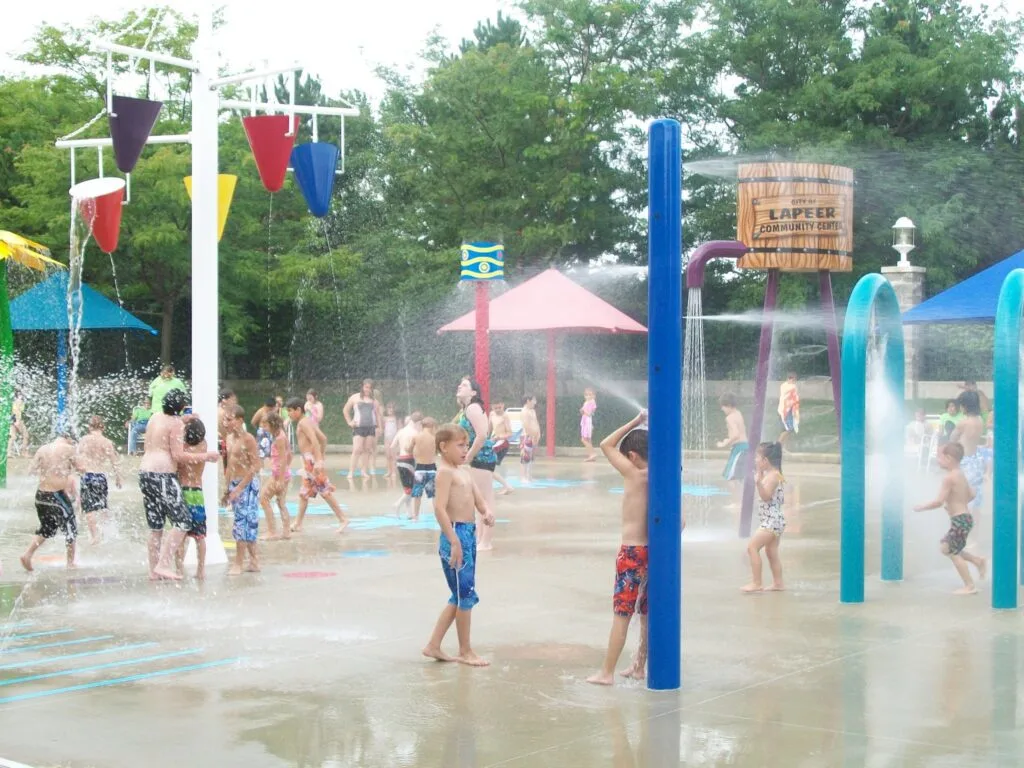 Children Playing In A Water Park.