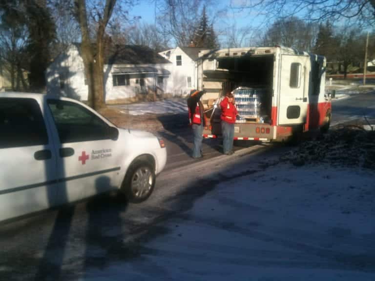 American Red Cross Volunteers Delivering Water And Filters To Flint Residents