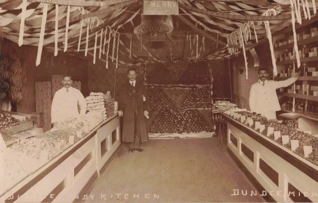 A Group Of Men Standing In A Store