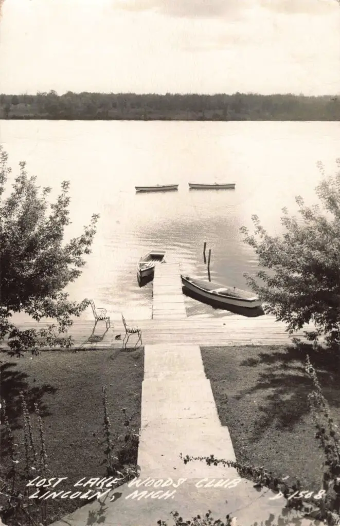 A Dock With Boats On It And A Dock With Chairs On The Water