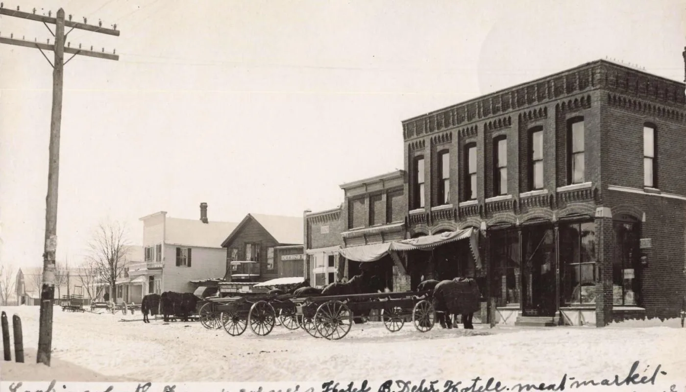 Snowy Streets, Horse Teams And Brick Storefronts — A Classic Look At Downtown Metamora, Likely Near The Village’s Famous Four Corners Crossroads.