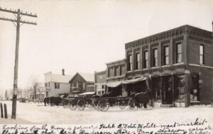 Snowy Streets, Horse Teams And Brick Storefronts — A Classic Look At Downtown Metamora, Likely Near The Village’s Famous Four Corners Crossroads.
