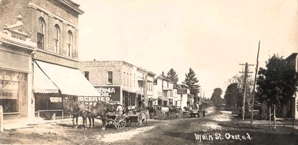 A Horse Drawn Carriage On A Street