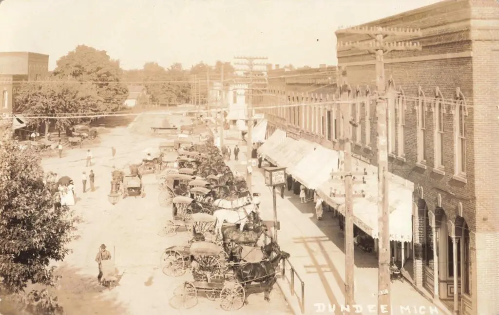 A Horse Carriages Parked On A Street