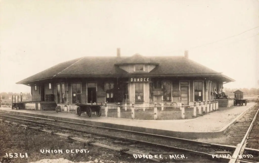 A Train Station With A Wagon On The Side
