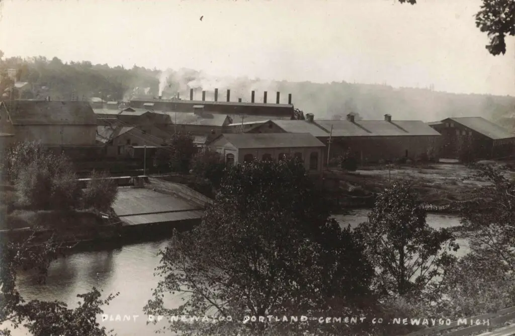 A Group Of Buildings Next To A River