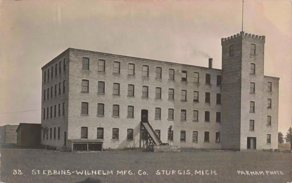 A Large Brick Building With A Staircase