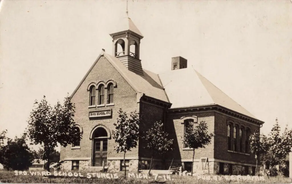 A Brick Building With A Bell Tower