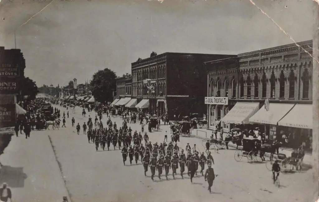 A Group Of Soldiers Marching On A Street