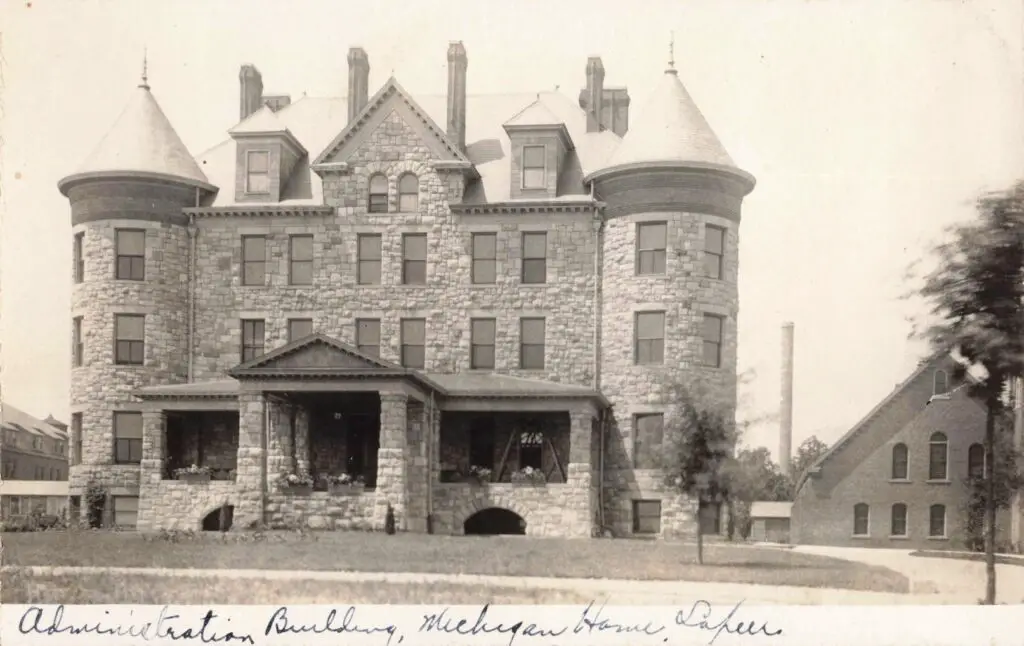 A Large Stone Building With A Large Porch