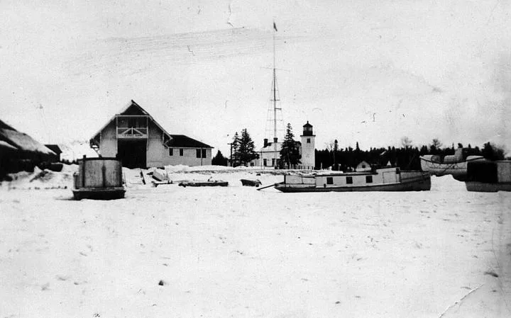 A Boat In The Snow Next To A Building