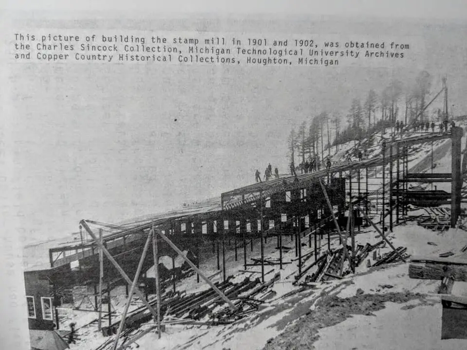 A Bridge With A Group Of People Walking On It - Freda Michigan History