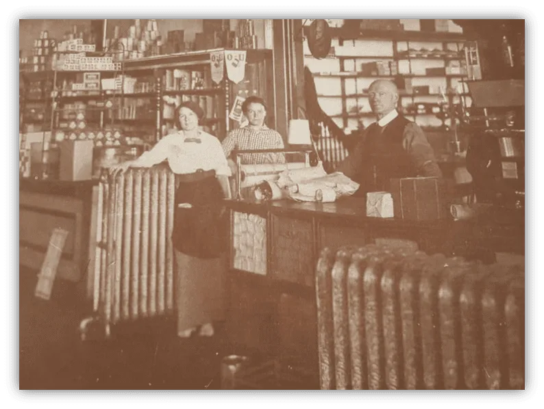 A Group Of People Standing In A Store