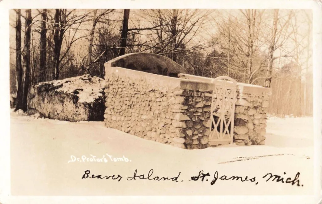 A Stone Structure With A Gate In The Snow