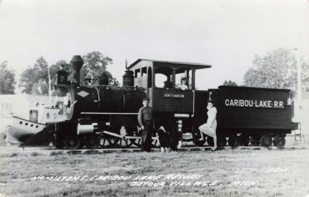 A Man And Woman Standing Next To A Train
