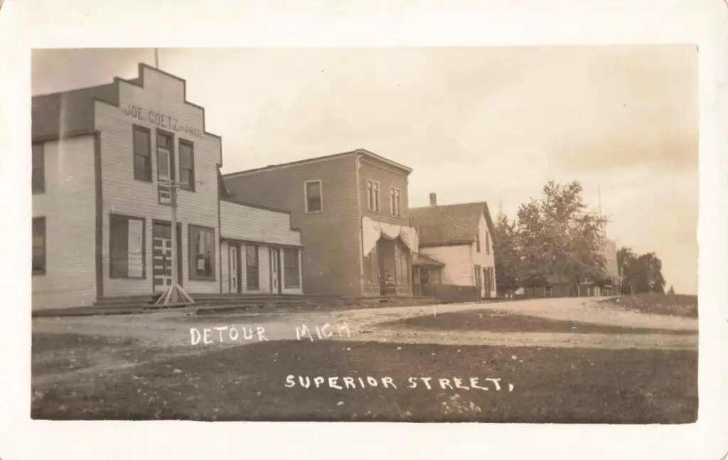 A Black And White Photo Of A Row Of Buildings