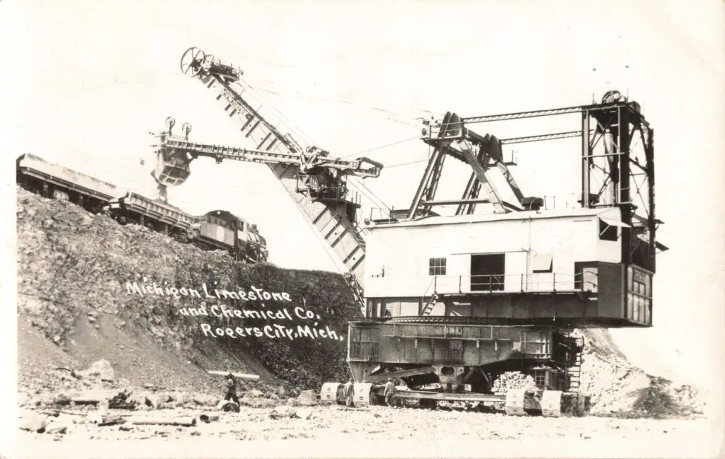 A Train On A Hill With A Crane