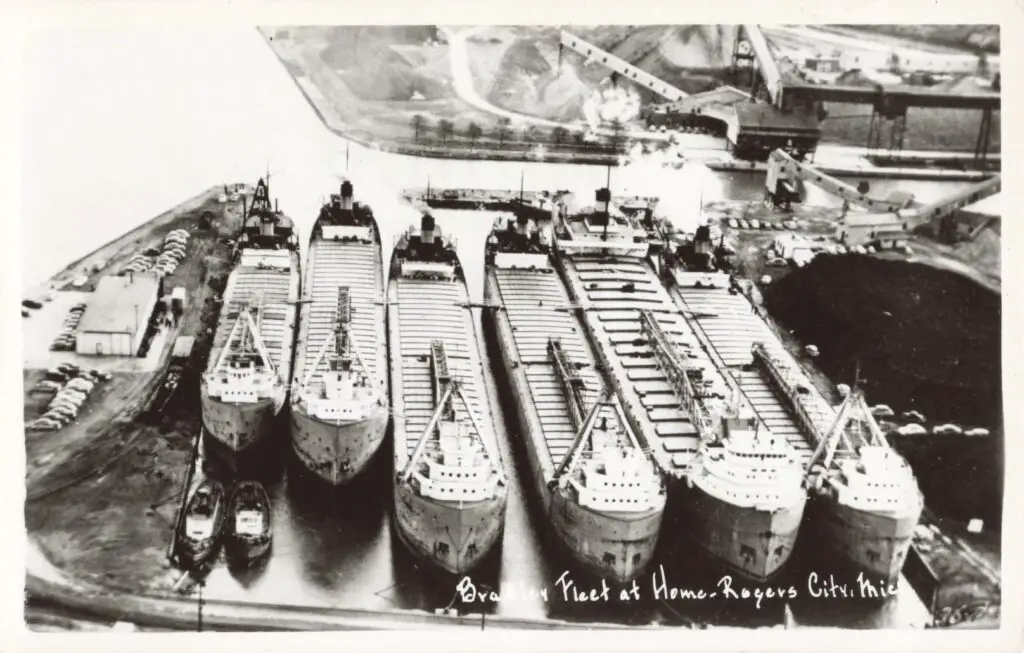 A Group Of Ships In A Harbor