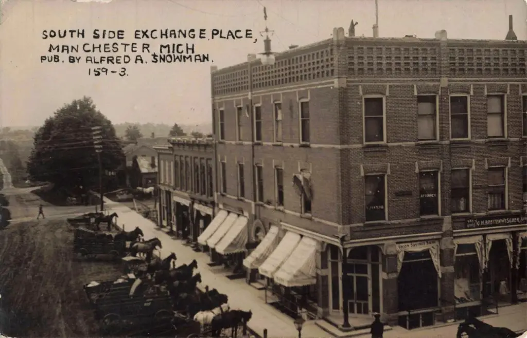 A Horse Drawn Carriages Parked On A Street