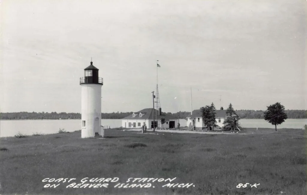 A Lighthouse On A Grassy Island
