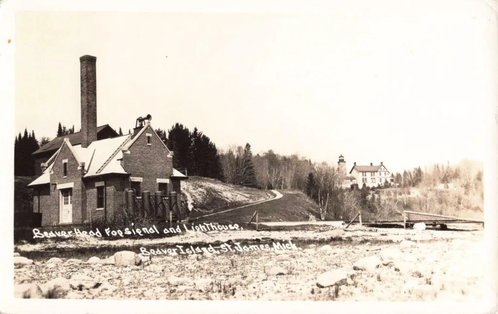 A Brick House With A Chimney And A Snowy Field