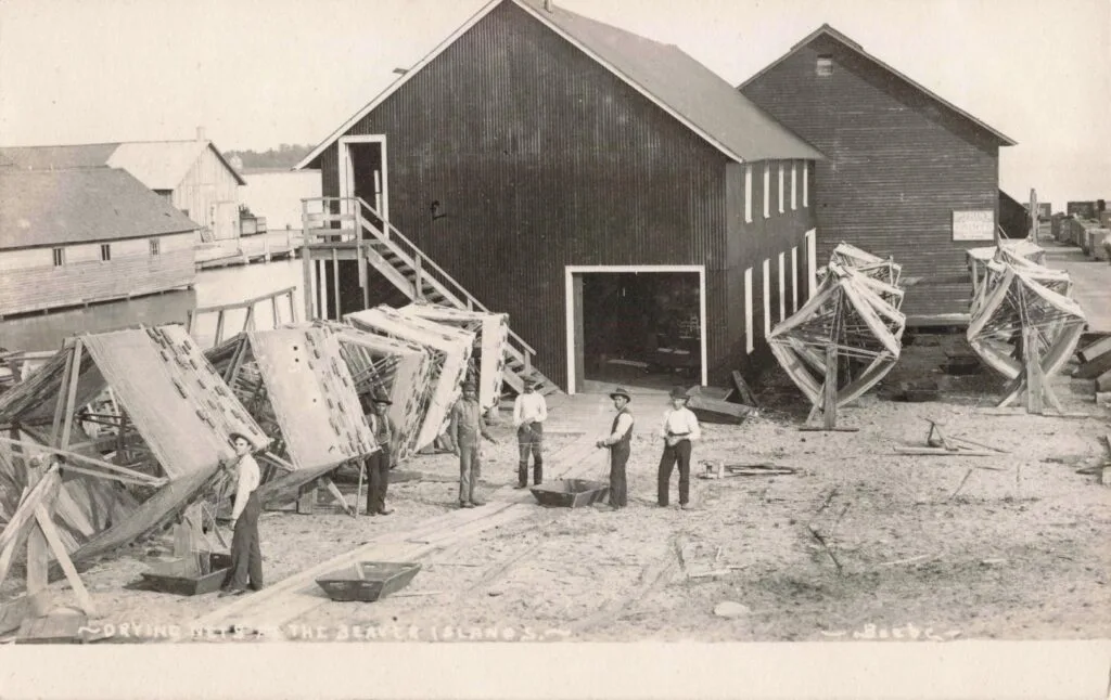A Group Of Men Standing Outside A Building