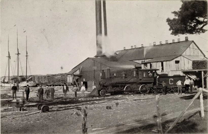 A Group Of People Standing Around A Train