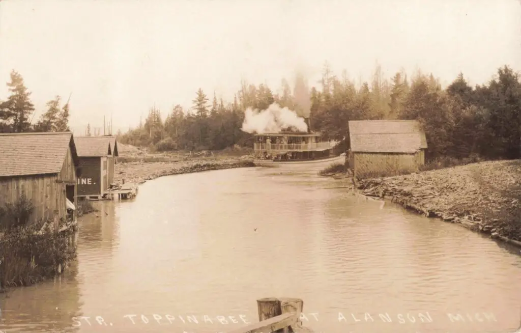 Historic Steamboat On Calm Waterway.