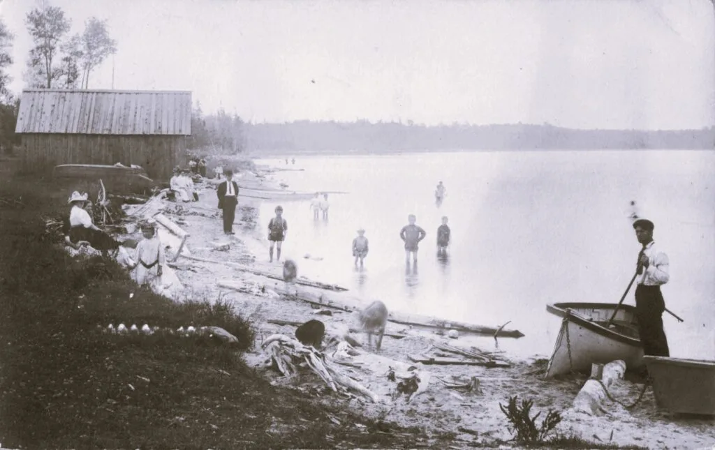 Historic Lakeside Scene With People.