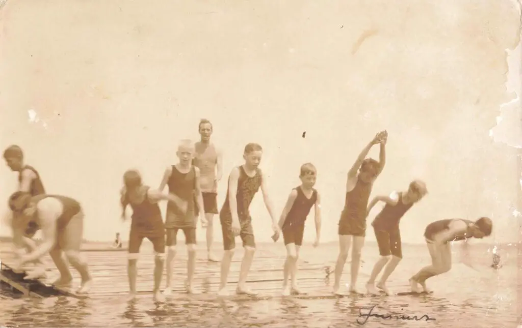 Children Playing At The Beach.