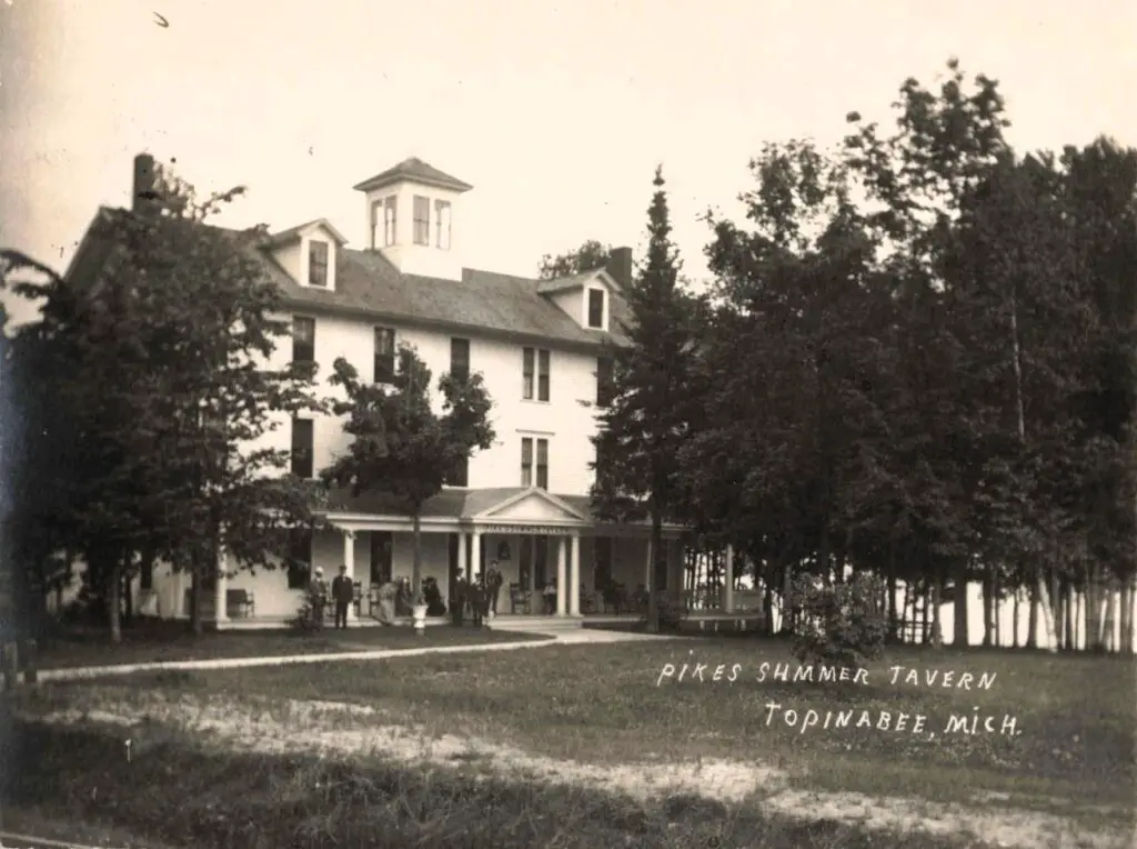 Historic Tavern Surrounded By Trees.