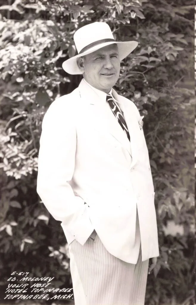 Man In White Suit And Hat.