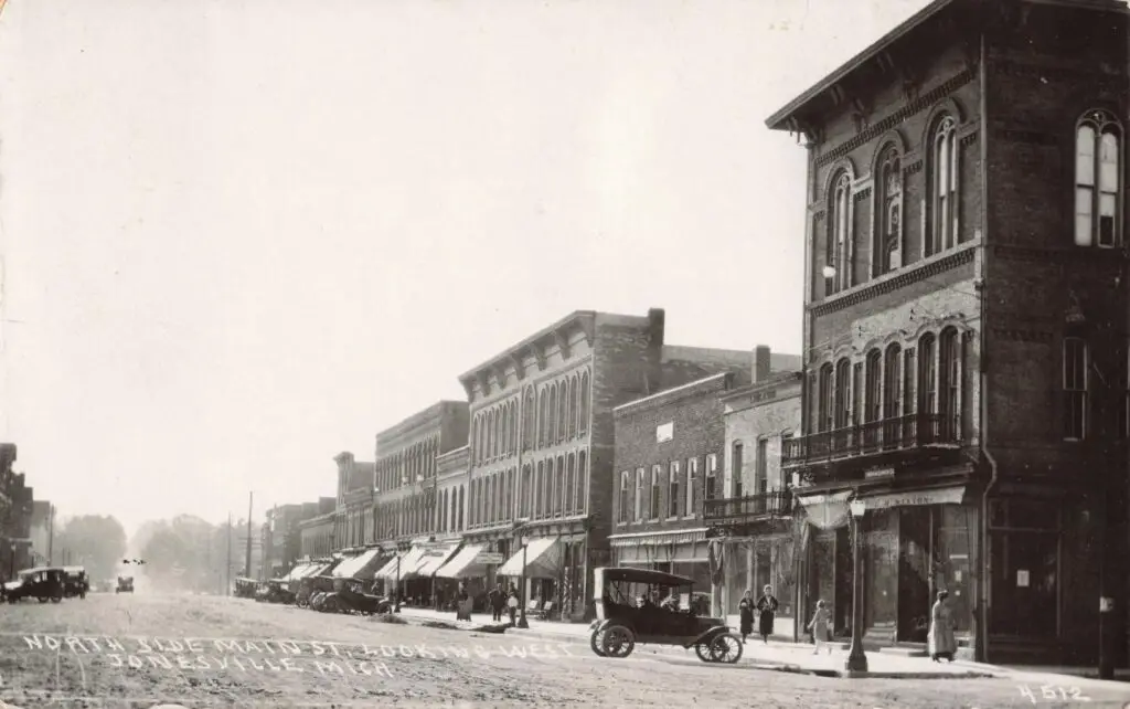 Historic Street View With Vintage Cars.