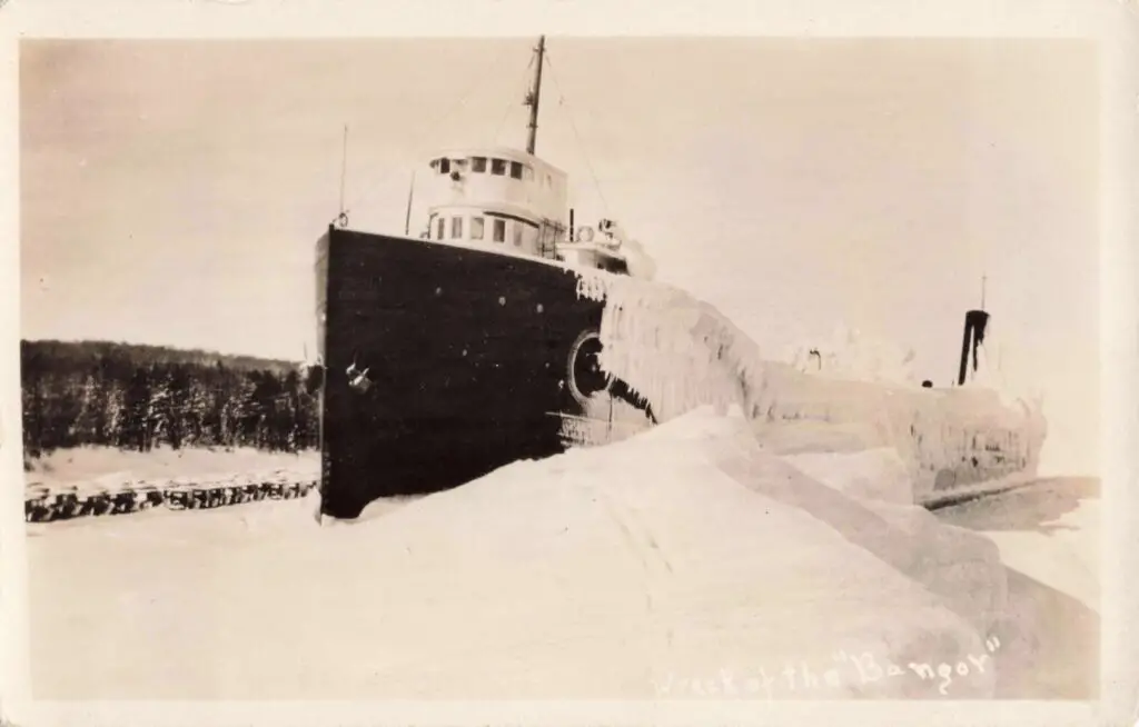 Ice-Covered Ship In Winter Landscape.