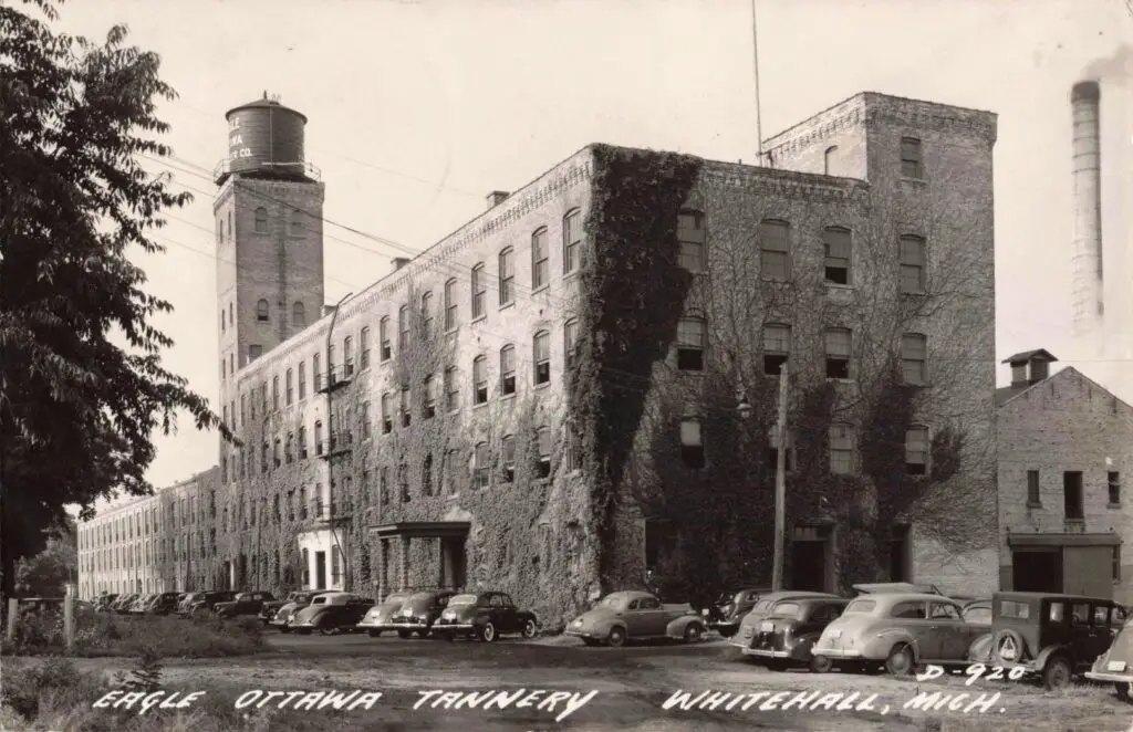 Historic Tannery Building With Vintage Cars.