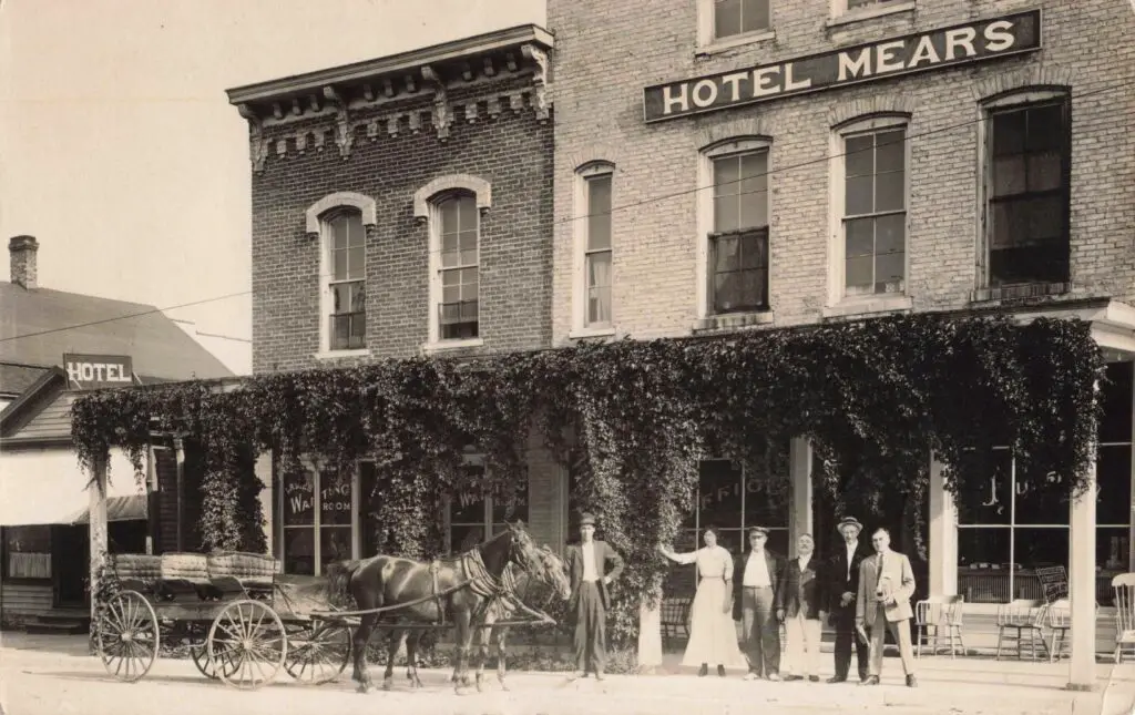 Historic Hotel With Horse-Drawn Carriage.