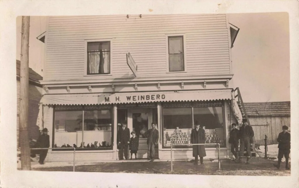 Historic Storefront With People Outside.
