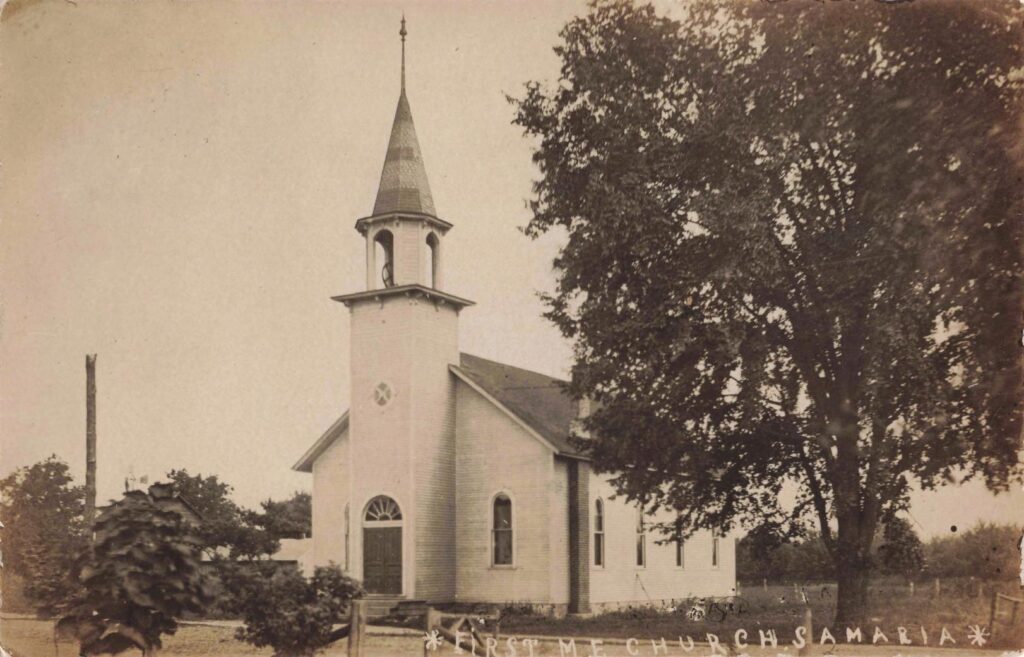 Historic Church With Steeple And Trees