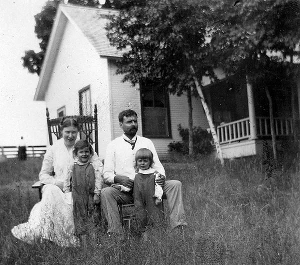 Family Portrait In Grassy Yard.
