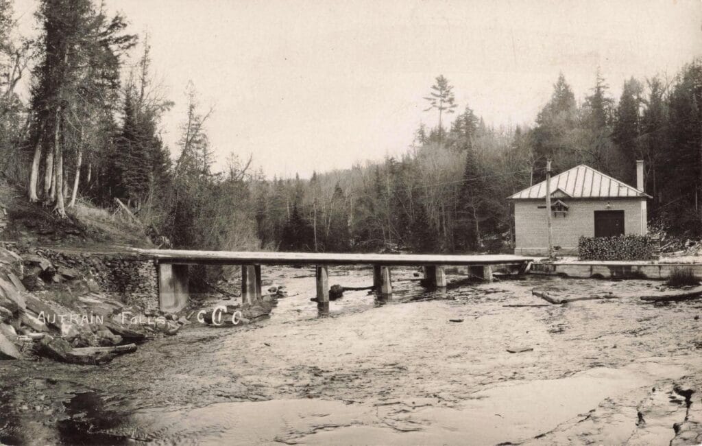 Historic Bridge Over A Serene River.