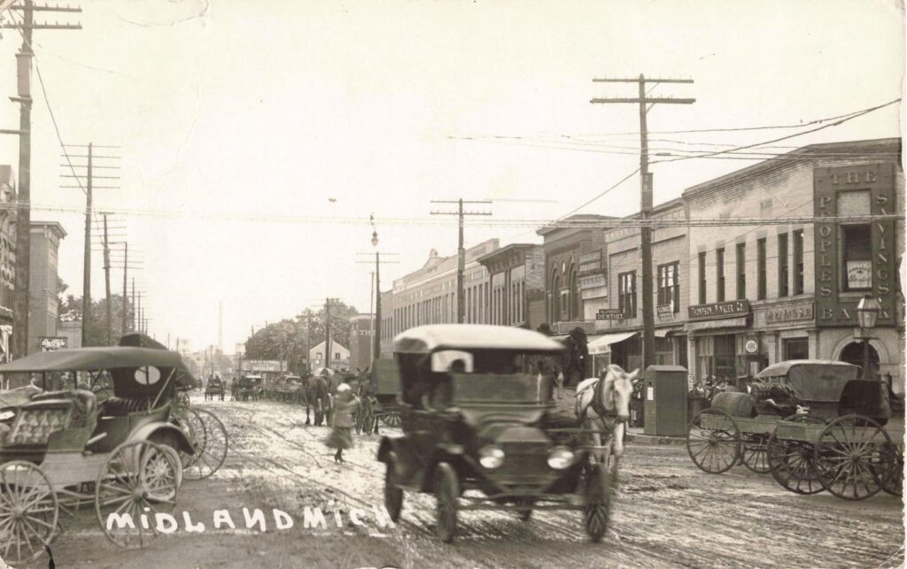 Historic Street Scene With Vintage Vehicles.