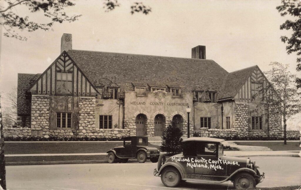 Historic Courthouse With Vintage Car.
