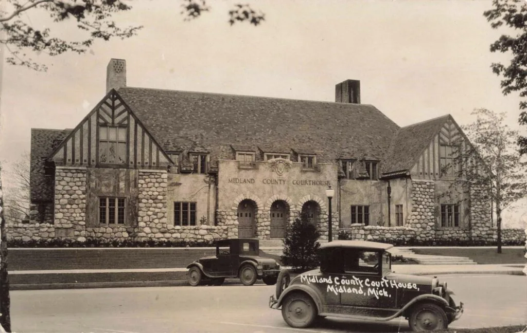 Historic Courthouse With Vintage Car.