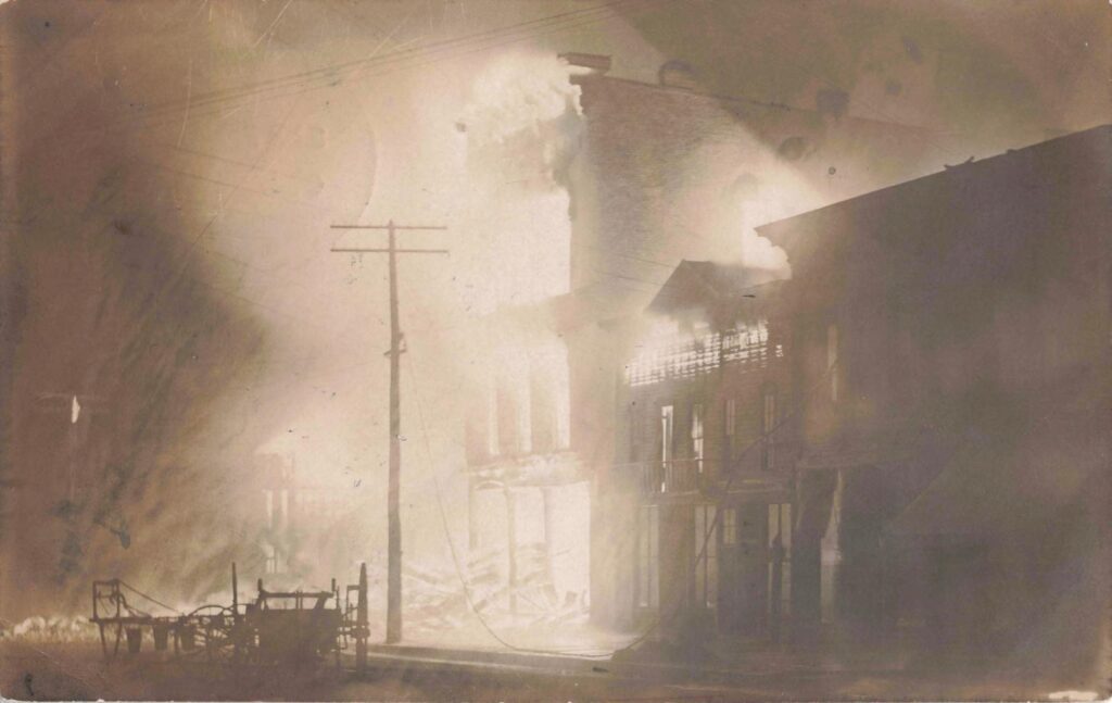 Building Engulfed In Flames And Smoke.