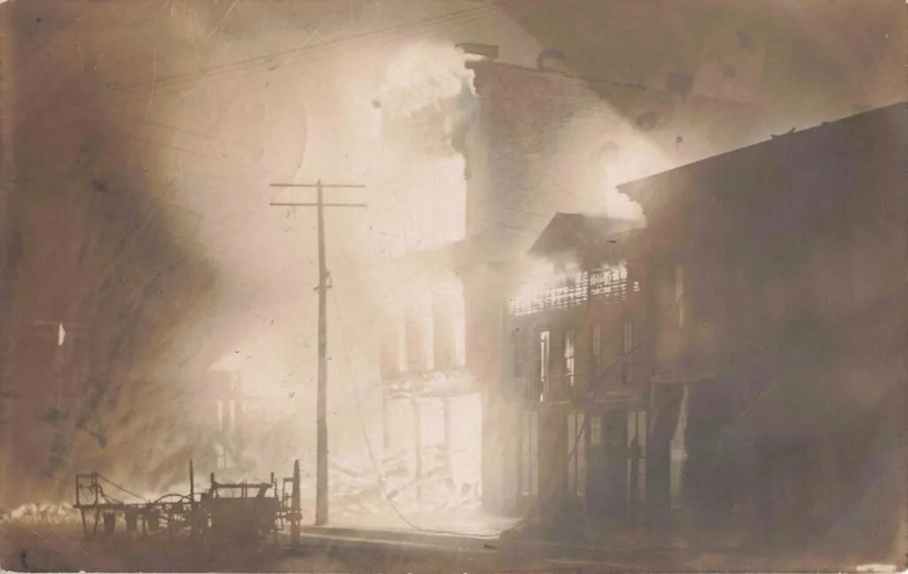 Building Engulfed In Flames And Smoke.