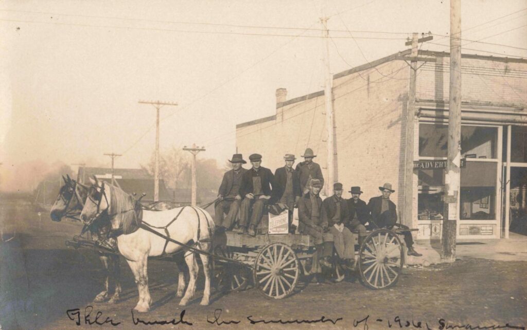 Horse-Drawn Wagon With Seated Men.