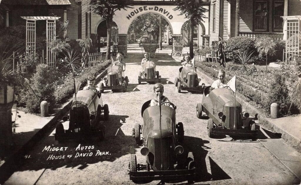 Children Driving Small Vintage Cars.