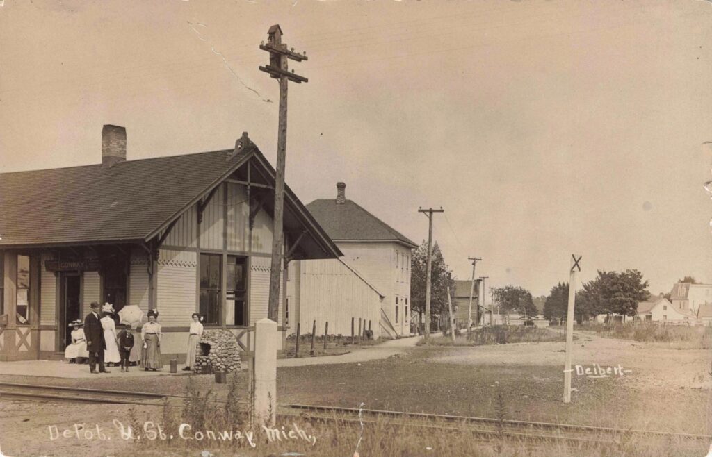 Historic Train Depot With People Outside